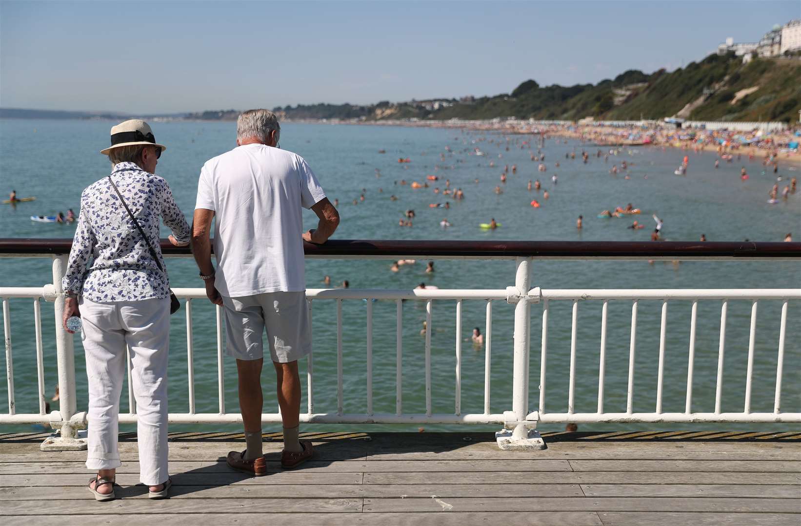 A couple look out from Bournemouth Pier (Andrew Matthews/PA)