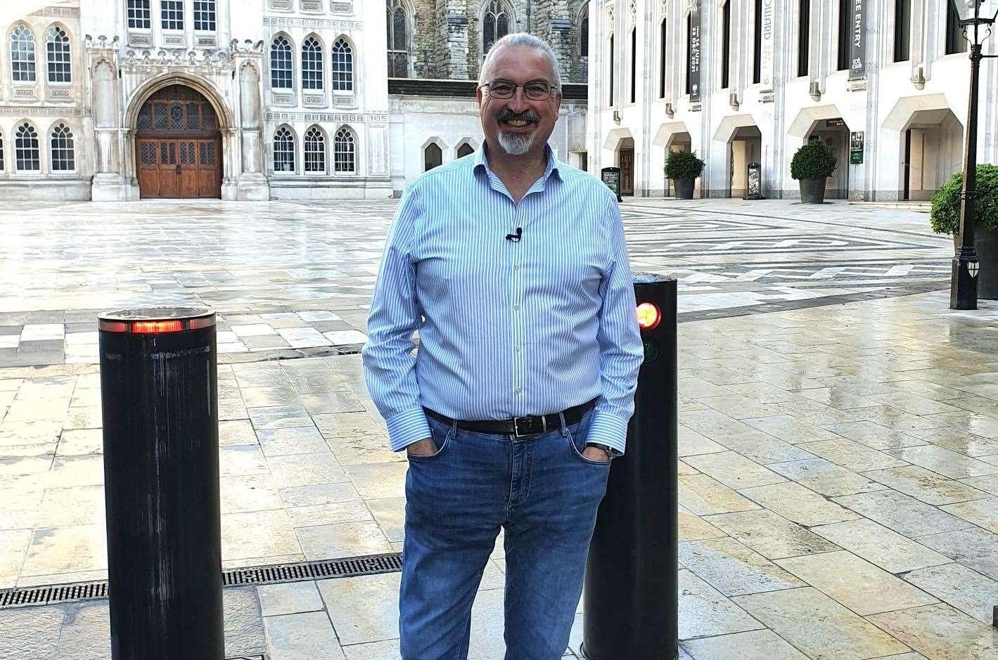 Dr Simon Elliott at the Guildhall courtyard in the City of London, standing above the Roman amphitheatre - he is a regularly on Hit History - the history buff's own version of Netflix