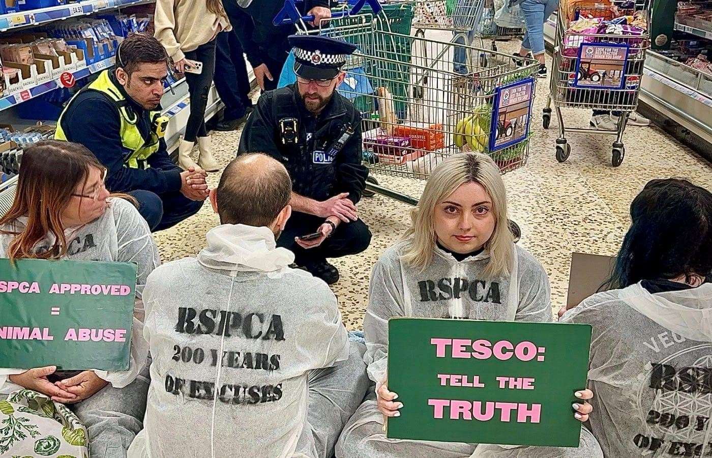 During the protest in the Ashford Tesco supermarket meat aisle, security and police spoke to the group. Picture: Animal Rising