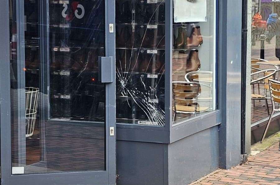 Damage caused to a window at Shoezone in Sittingbourne High Street during trouble in the town centre