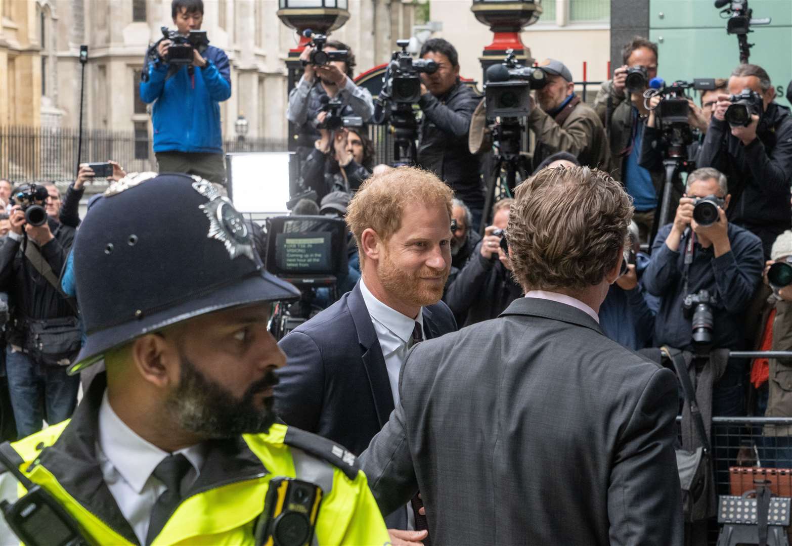 There was a huge media presence outside the court when Harry arrived (Jeff Moore/PA)