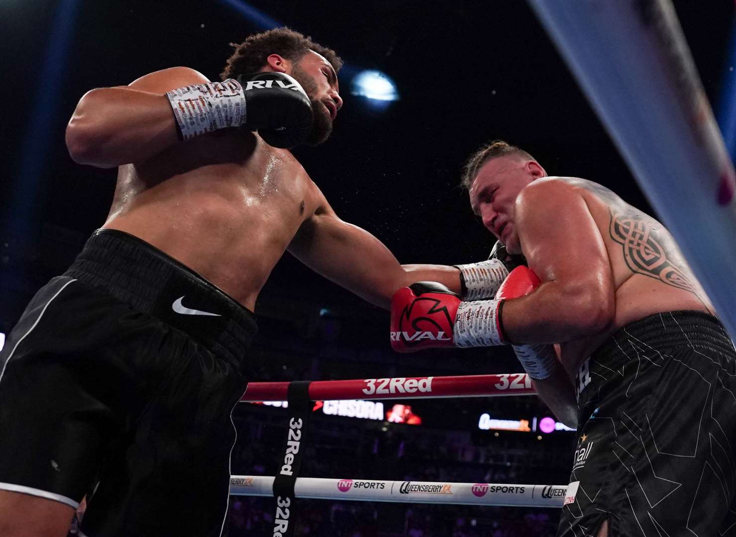 Moses Itauma lands another blow on Mariusz Wach - the contest lasted just two rounds. Picture: Stephen Dunkley / Queensberry