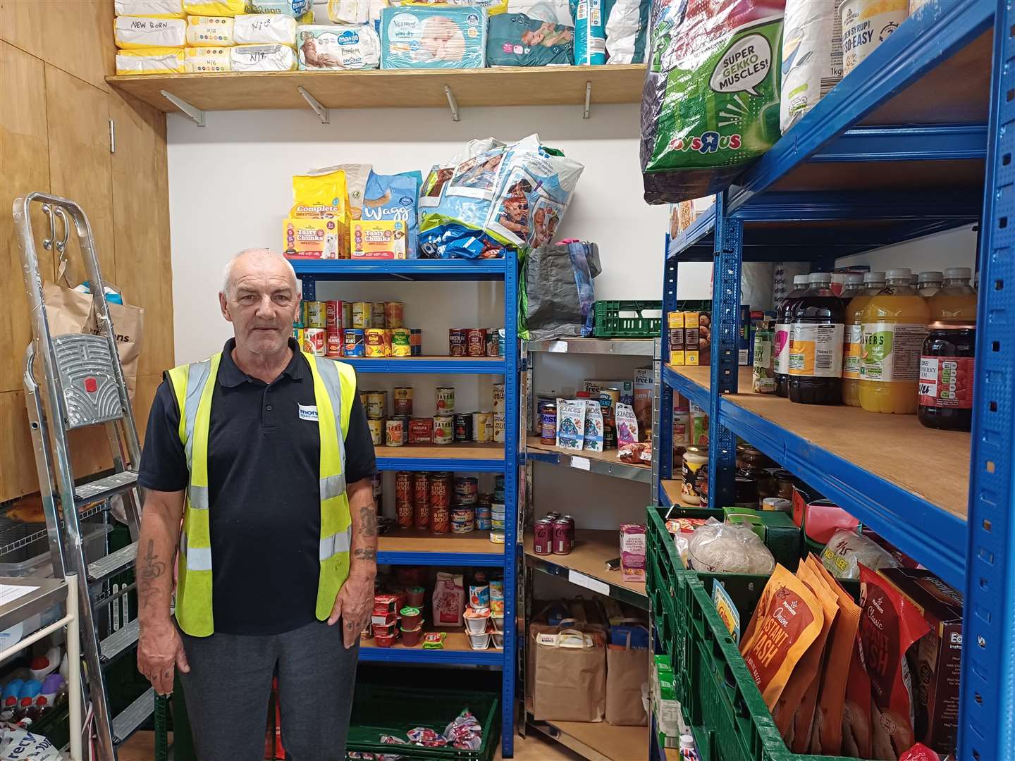 Trevor manages the new food bank in the building