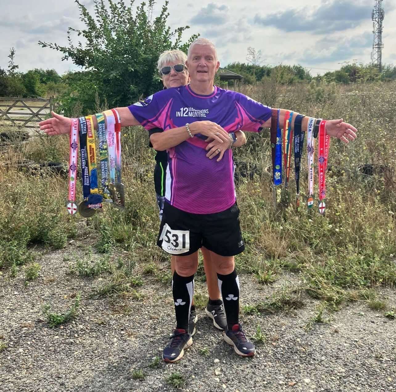 Chris Moreton, pictured with wife Sue, has completed 12 marathons in 10 months at the age of 70