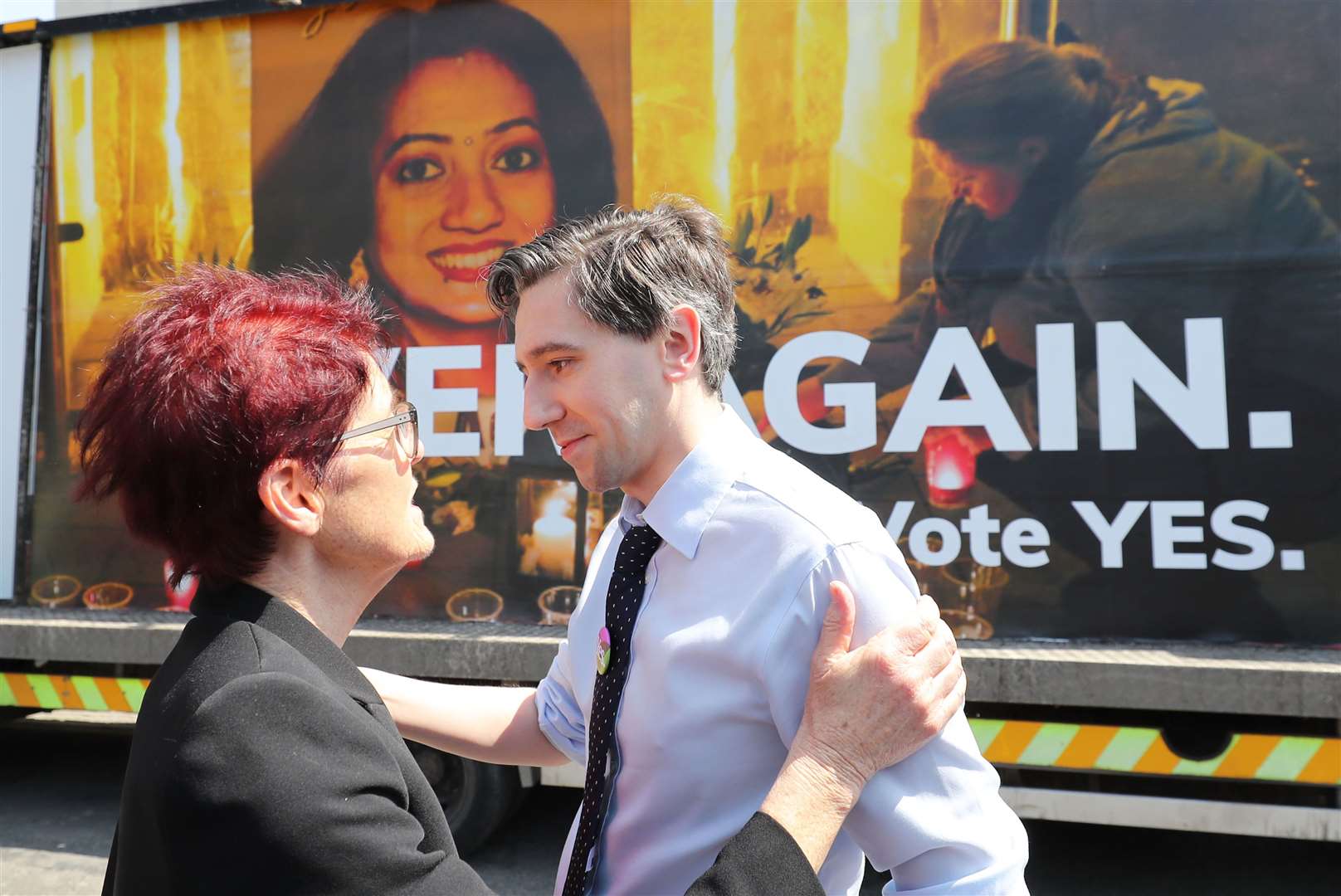 Ailbhe Smyth, convenor of the Coalition to Repeal the Eighth Amendment, hugs Simon Harris during a Together for Yes billboard launch in Dublin (Niall Carson/PA)