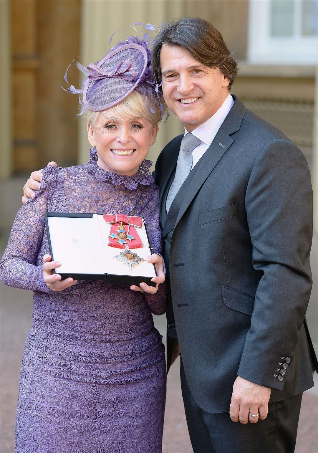 Dame Barbara Windsor and husband Scott Mitchell upon being made a Dame in 2016 (John Stillwell/PA)