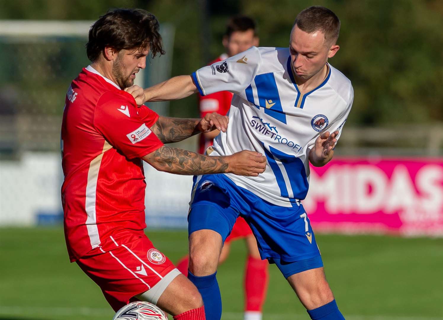 Bearsted's hat-trick hero Michael Hagan up against Hollands & Blair midfielder George Monger Picture: Ian Scammell