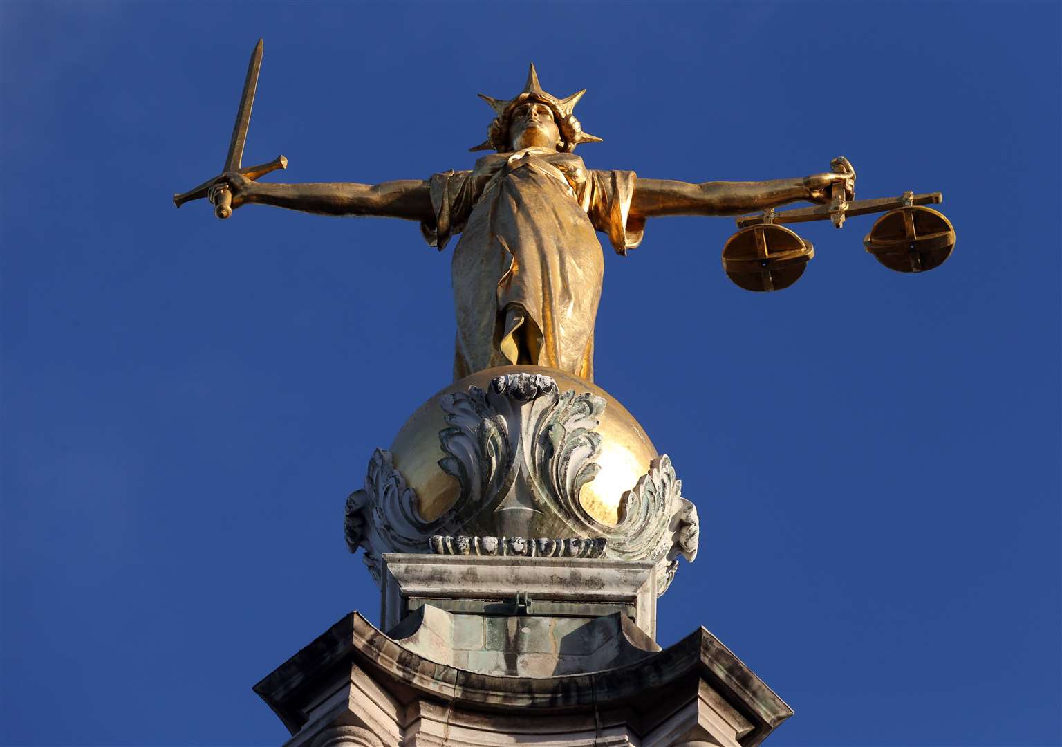 FW Pomeroy’s Statue of Justice stands above the Central Criminal Court building, Old Bailey, London (Jonathan Brady/PA)