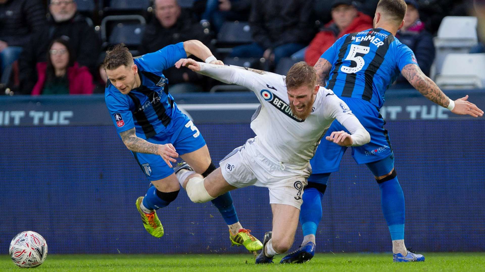 Mark Byrne and Max Ehmer get stuck in against Swansea's Oli McBurnie Picture: Ady Kerry