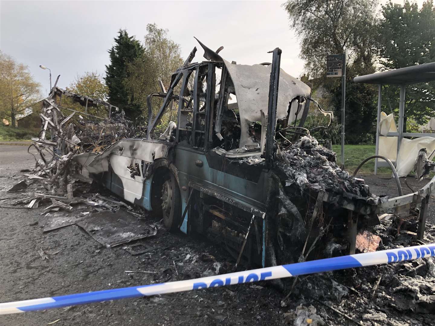 The scene on Abbott Drive in Newtownards near Belfast, after a bus was hijacked and set alight in an attack politicians have linked to loyalist opposition to Brexit’s Northern Ireland Protocol (David Young/PA)