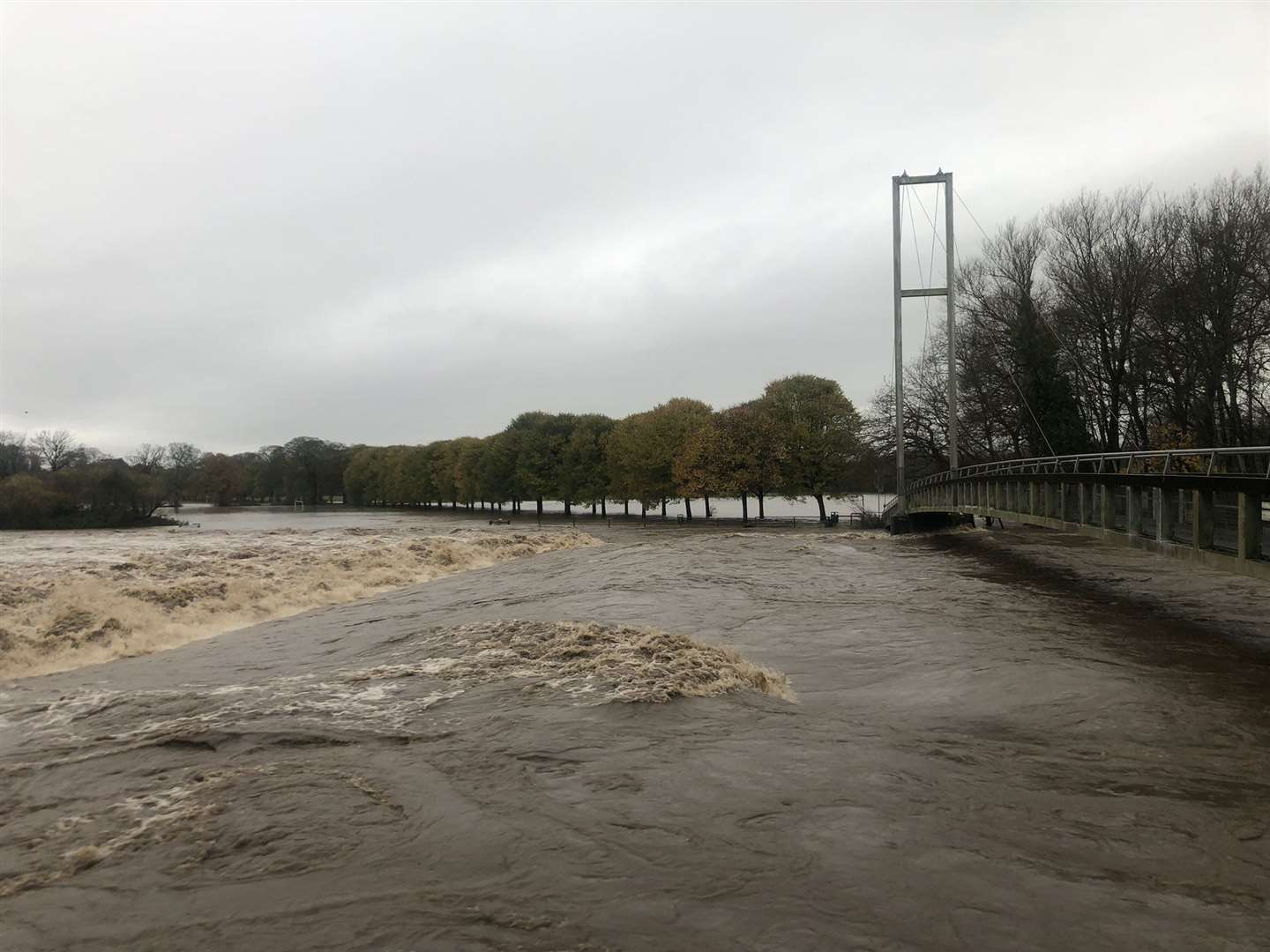 The River Taff flooding in Pontypridd, Wales (Ceri Davies/PA)