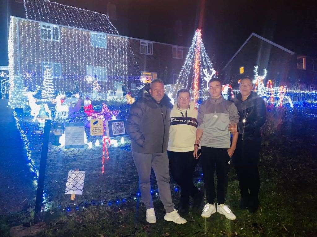 The Clark family with their impressive Christmas lights display