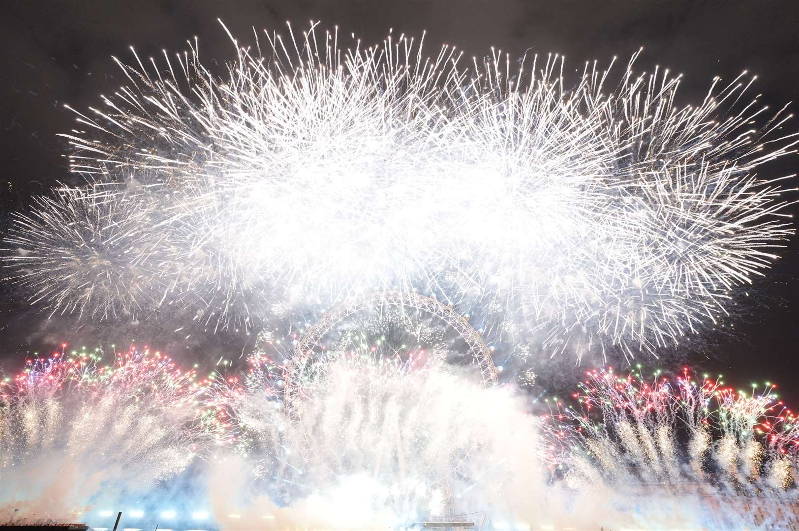 Fireworks light up the sky over the London Eye (Jonathan Brady/PA)