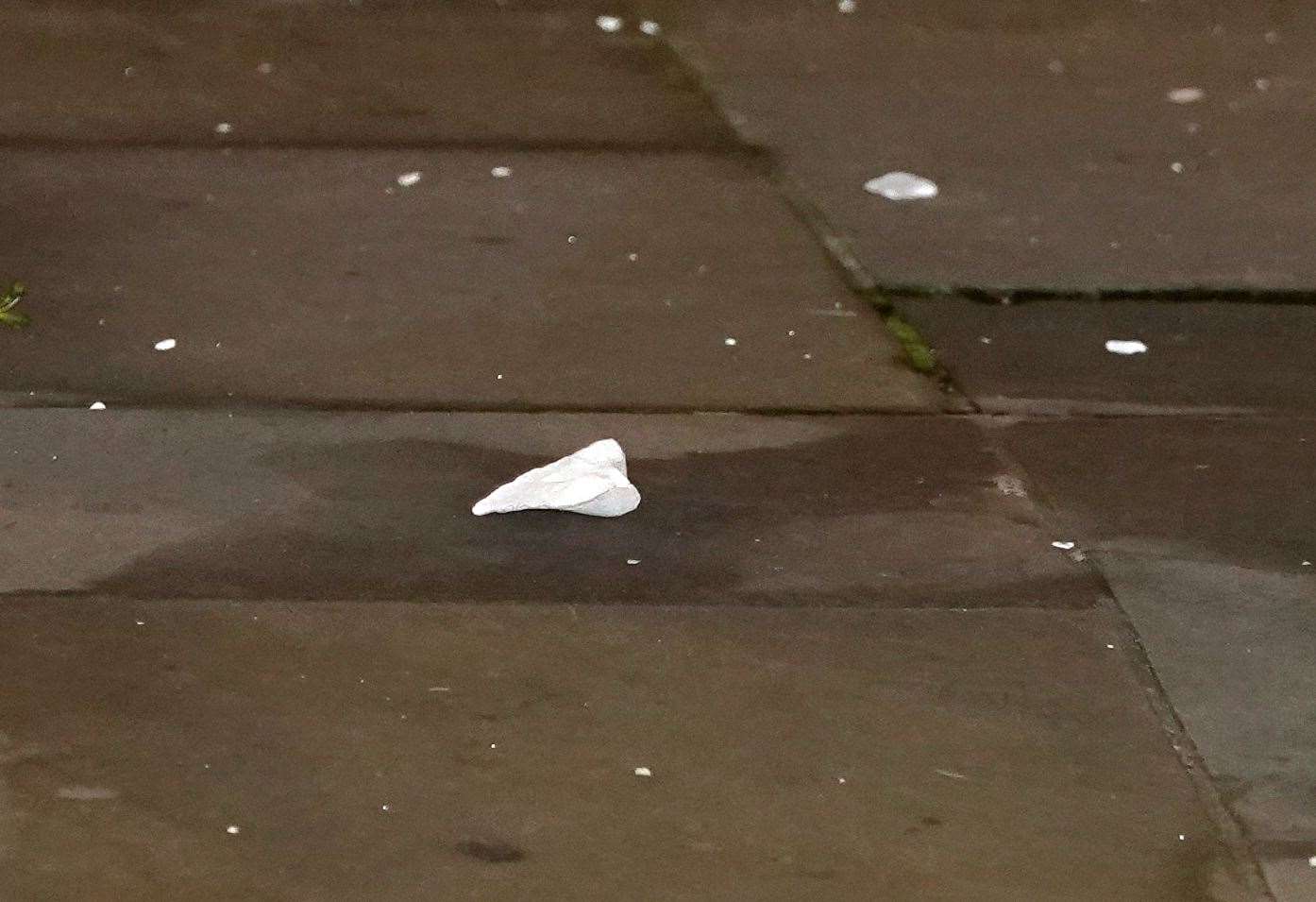 Pieces of stone are seen on the ground after the man began his attempted action to remove it earlier on Wednesday (Ian West/PA)