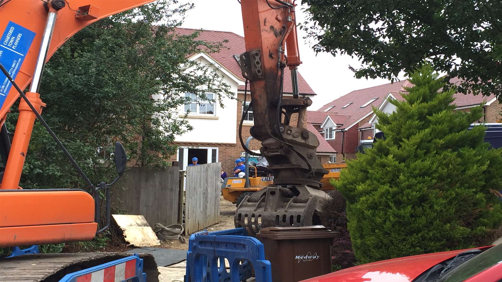 The bulldozers are waiting to demolish the home