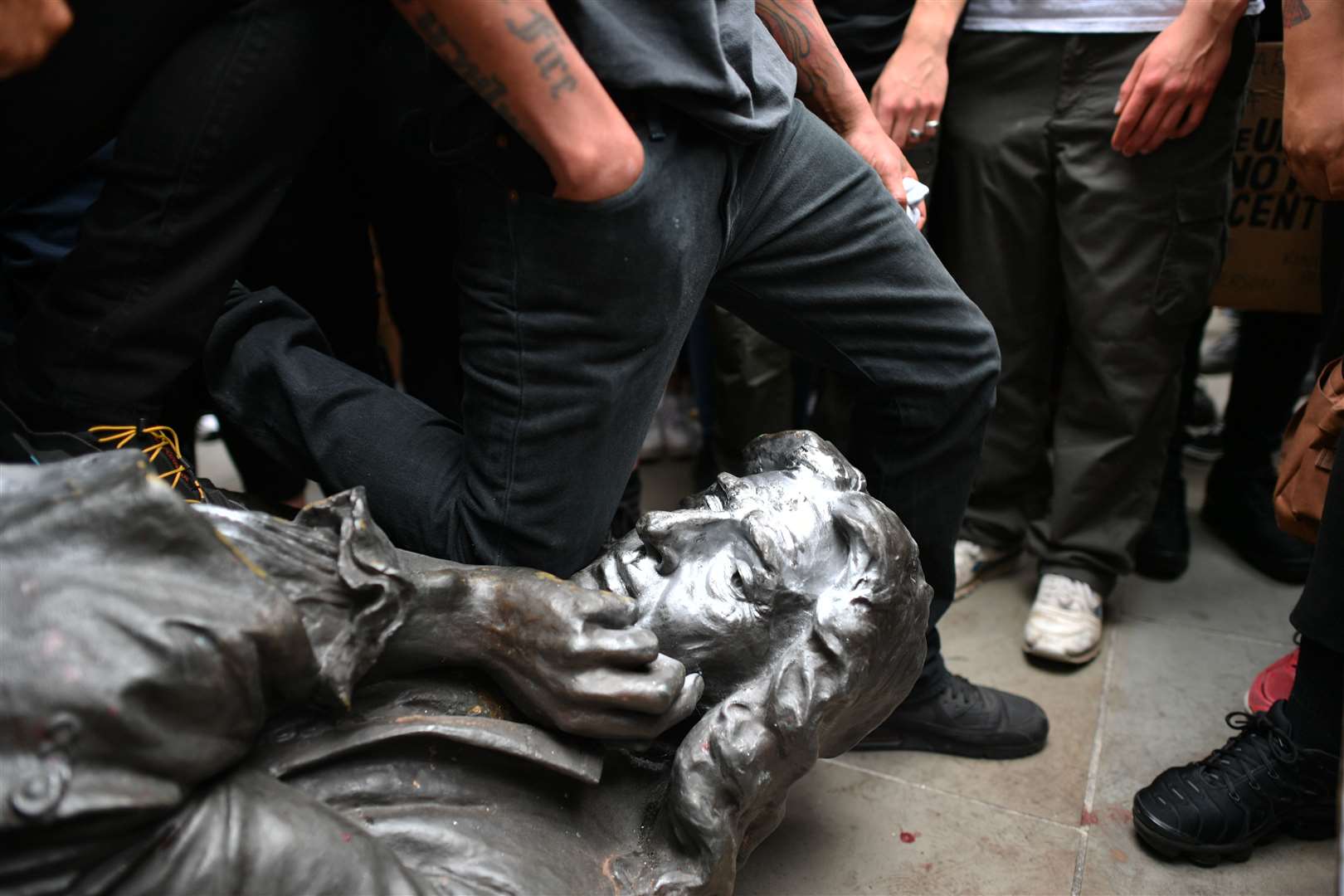 Protesters pull down a statue of Edward Colston, a figure connected with slavery, in Bristol (Ben Birchall/PA)