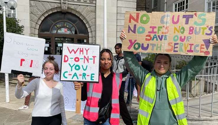 Young people protesting outside County Hall in Maidstone over youth service funding cuts