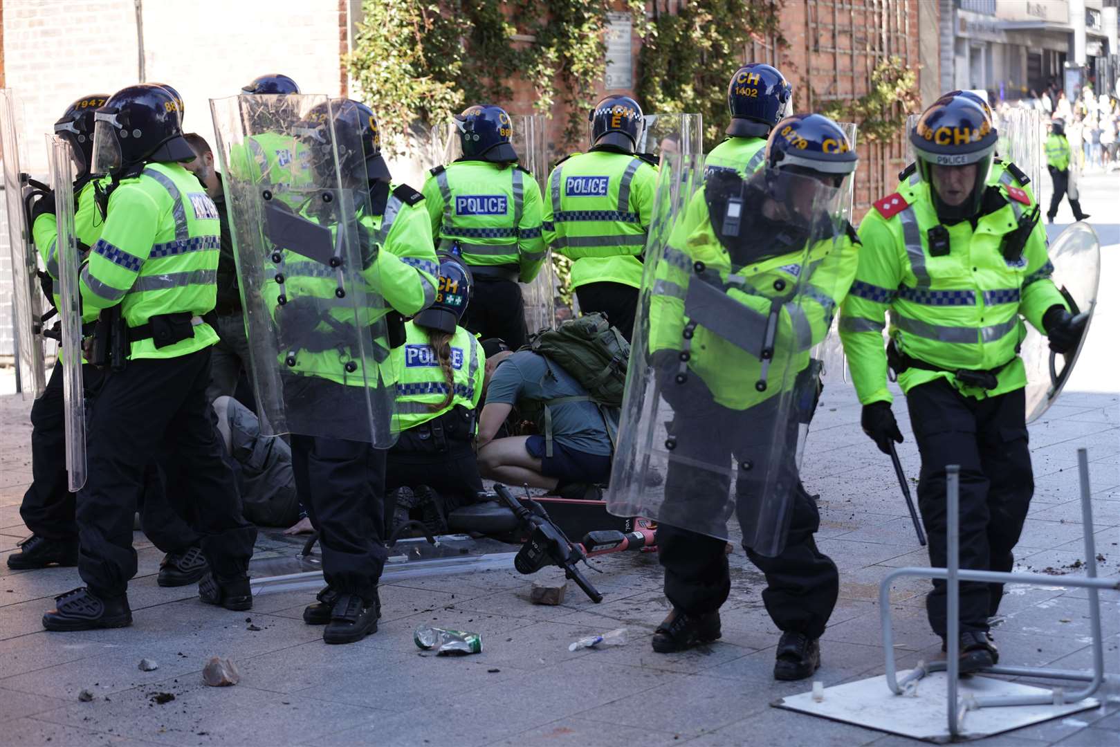 An injured man is attended to during a protest in Liverpool (James Speakman/PA)