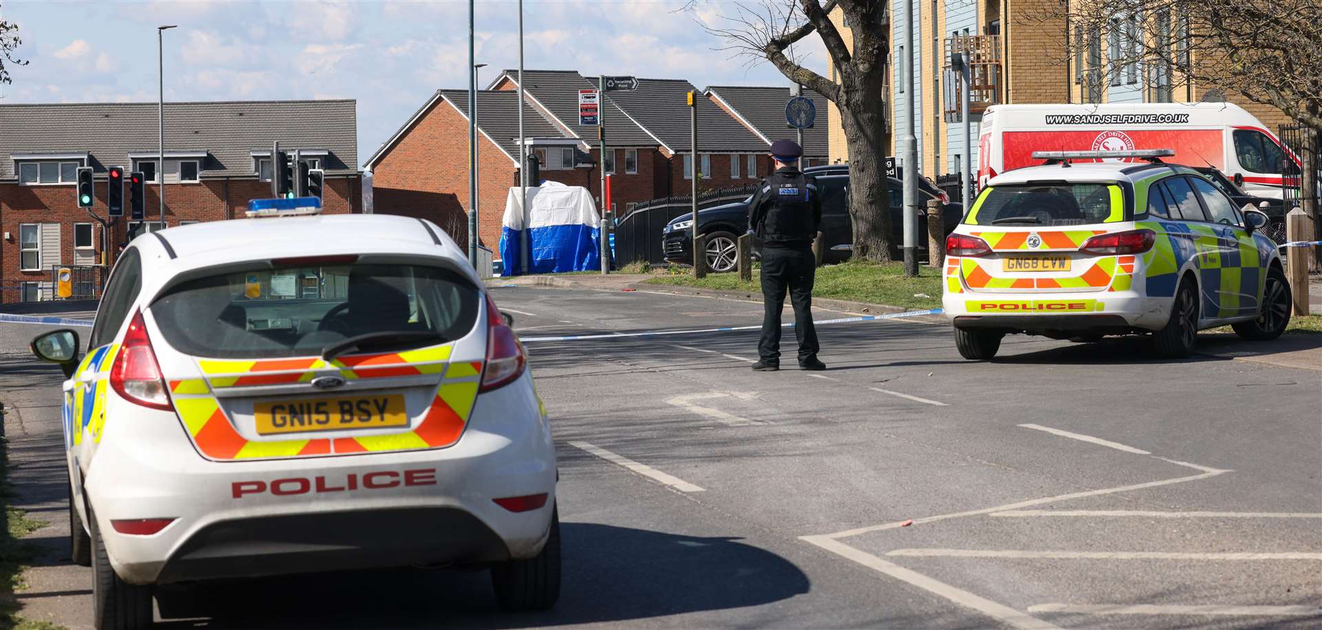 Police guarding the scene in Temple Hill today. Picture UKNIP