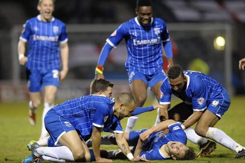 Jake Hessenthaler is mobbed by team-mates after scoring his wonder goal against Coventry. Picture: Barry Goodwin