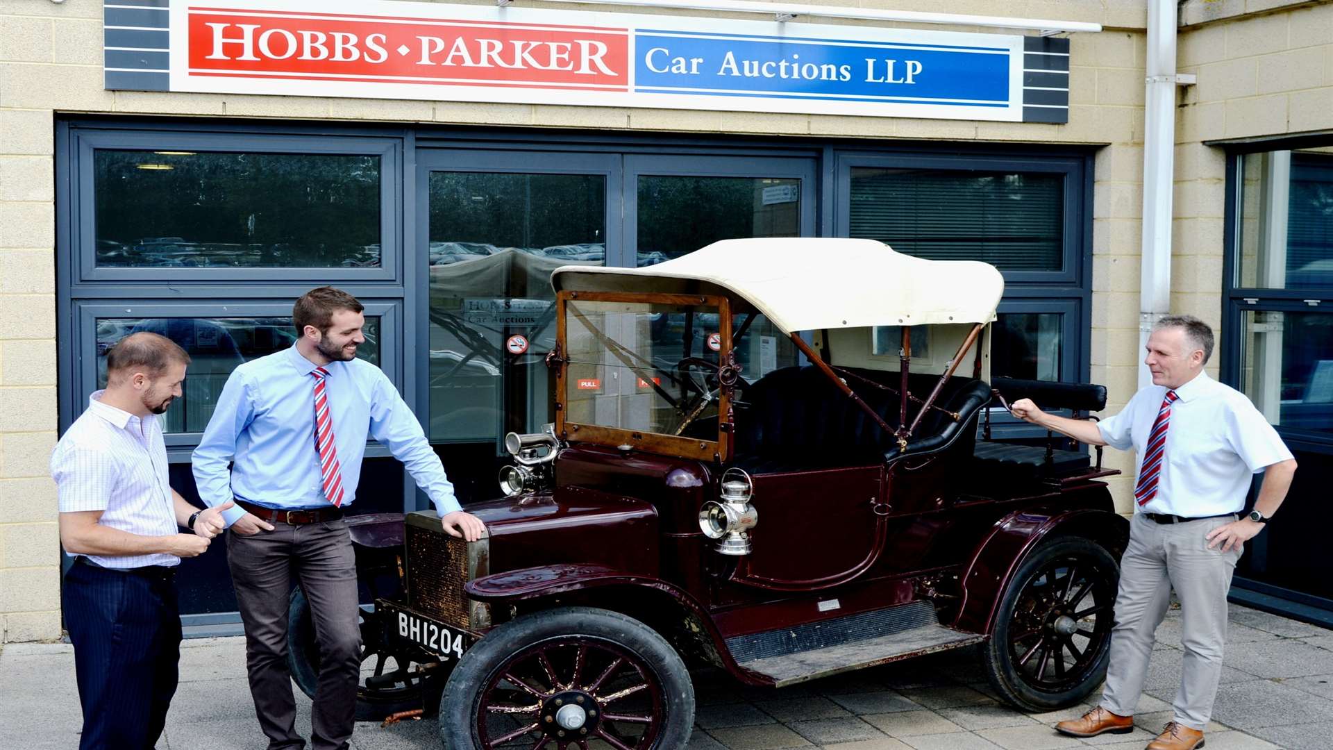 The Hobbs Parker Car Auctions team examine a 1909 Rover 8 Tourer, one of the entries for their next classic car auction