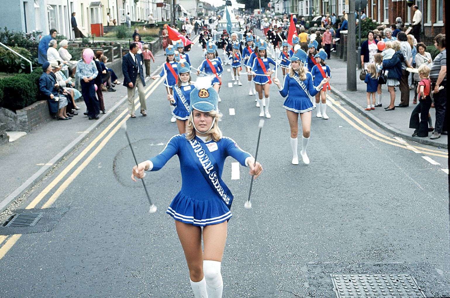 Rolvenden piping band following the floats at the Ashford Carnival procession through the town centre in 1975. Picture: Tam Fox