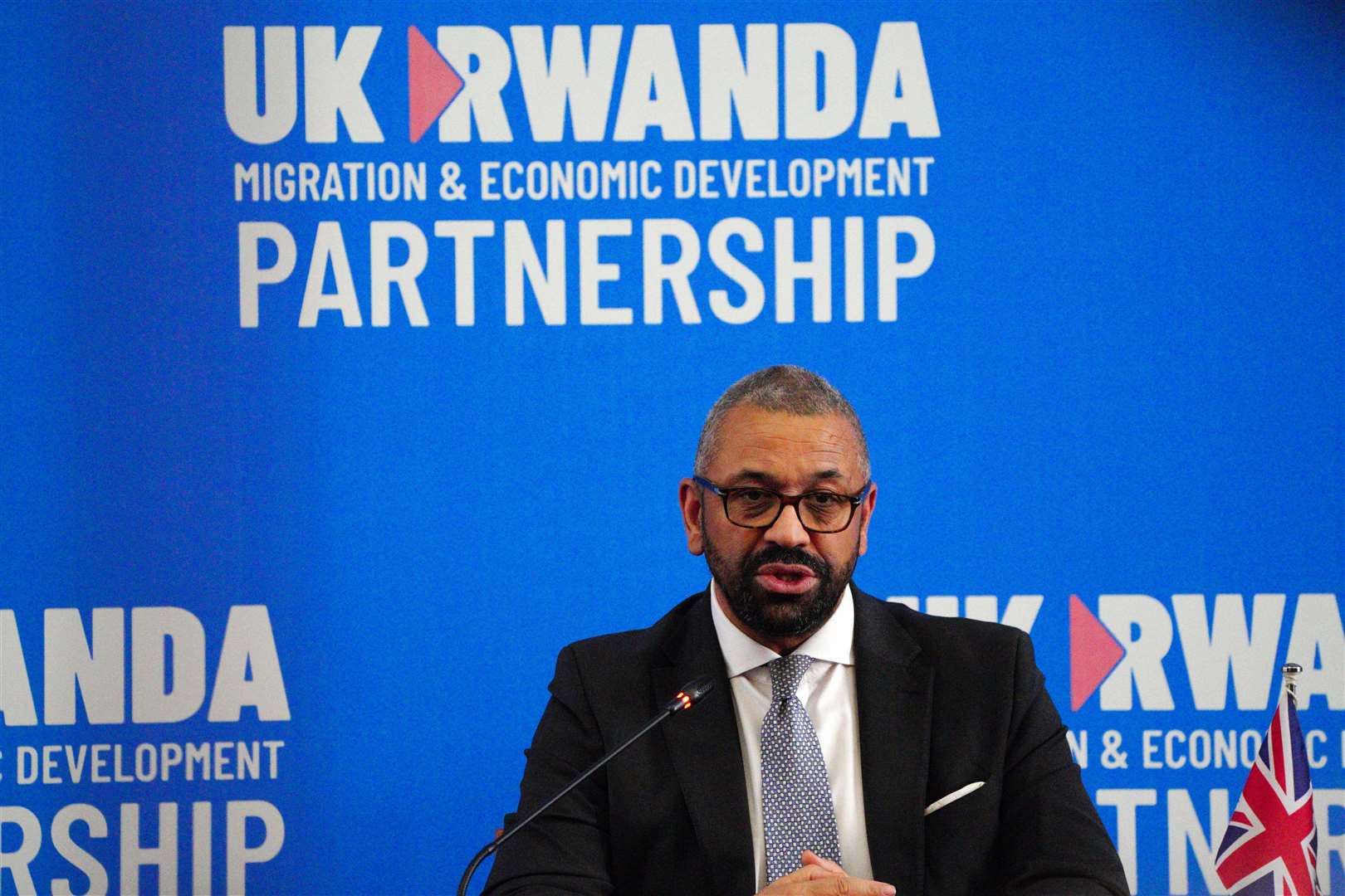 Then-home secretary James Cleverly speaks during a press conference with Rwandan minister of foreign affairs Vincent Biruta (Ben Birchall/PA)