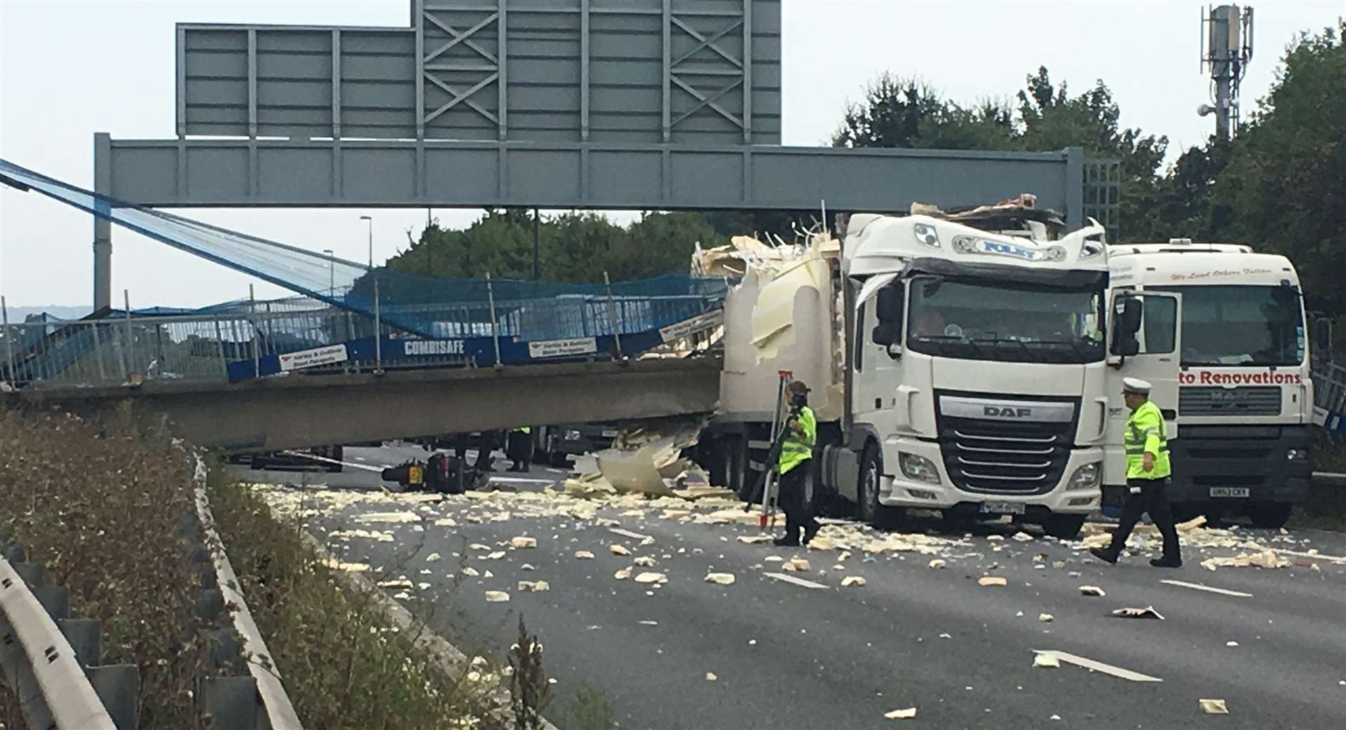 The damage caused to a pedestrian footbridge on the M20