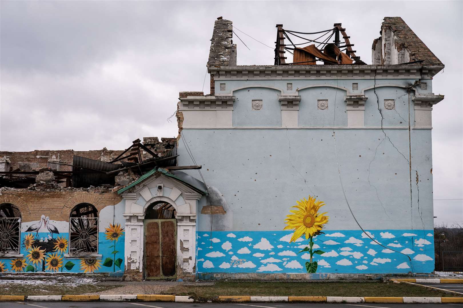 Sunflowers, Ukraine’s national flower, painted on a destroyed building near Bocha on the outskirts of the capital (Aaron Chown/PA)