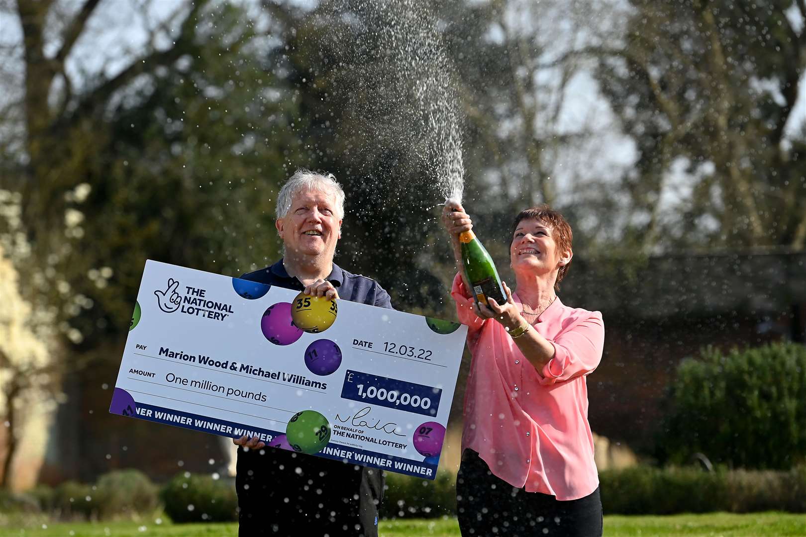 Marion Wood and Michael Williams celebrate (The National Lottery/PA)