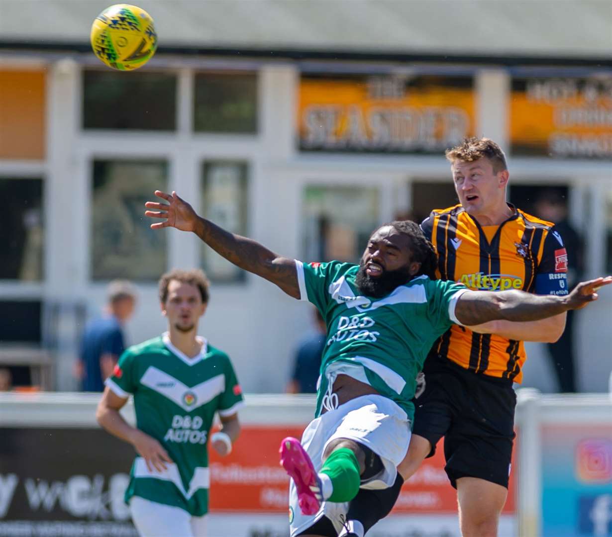 Ashford’s Michael Uwezu and Folkestone defender Callum Davies in action on Sunday as the Nuts & Bolts were beaten. Picture: Ian Scammell