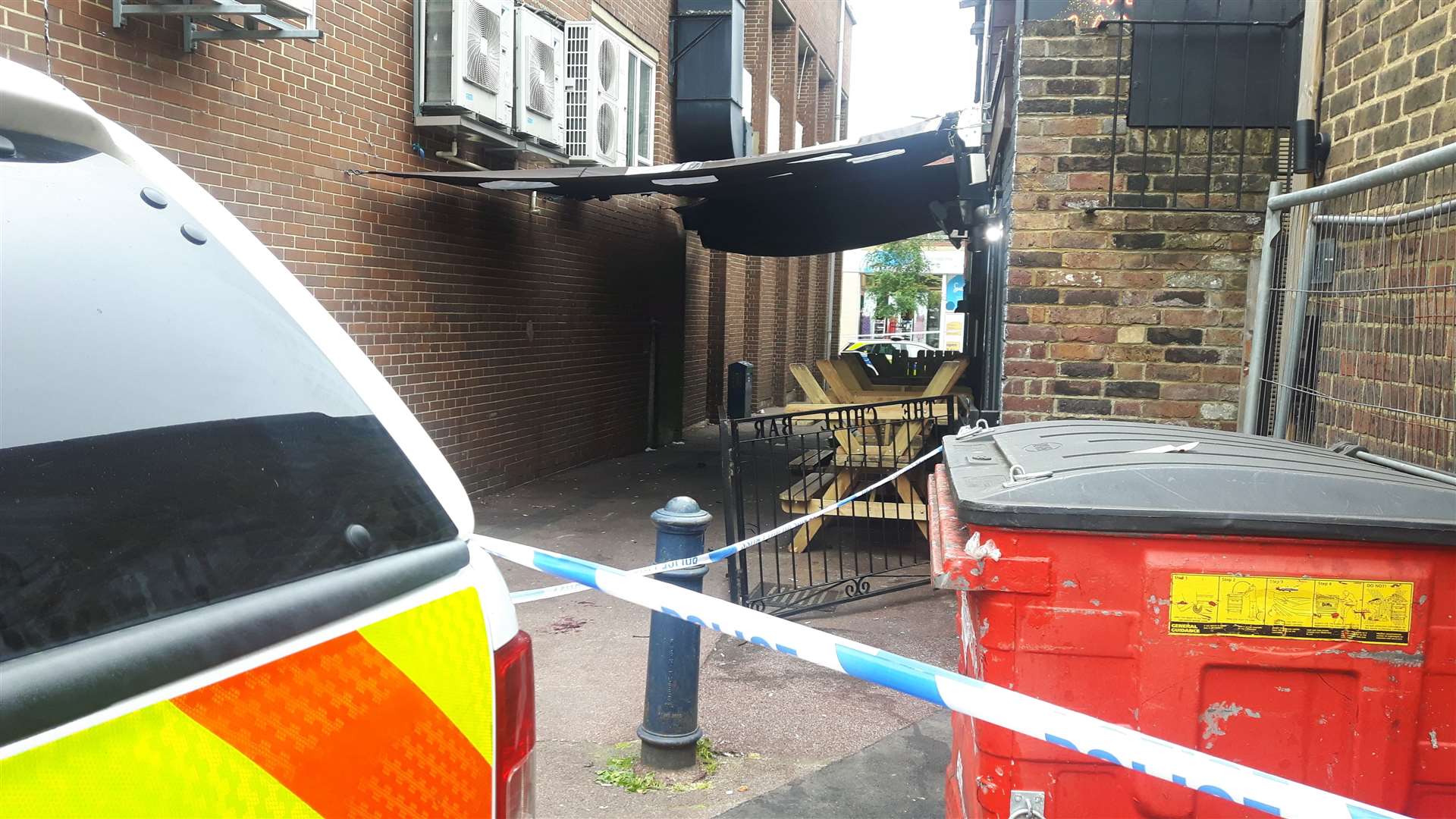 The cordon is also in Station Road, the other side of the alleyway