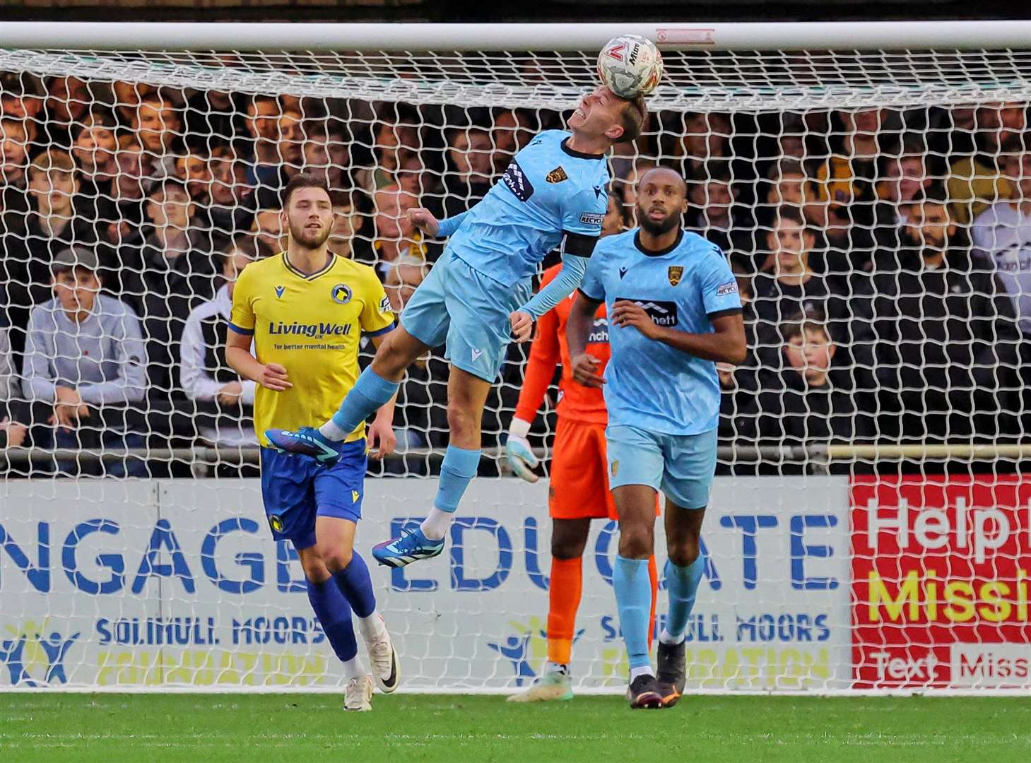 Maidstone skipper Sam Corne heads clear. Picture: Helen Cooper