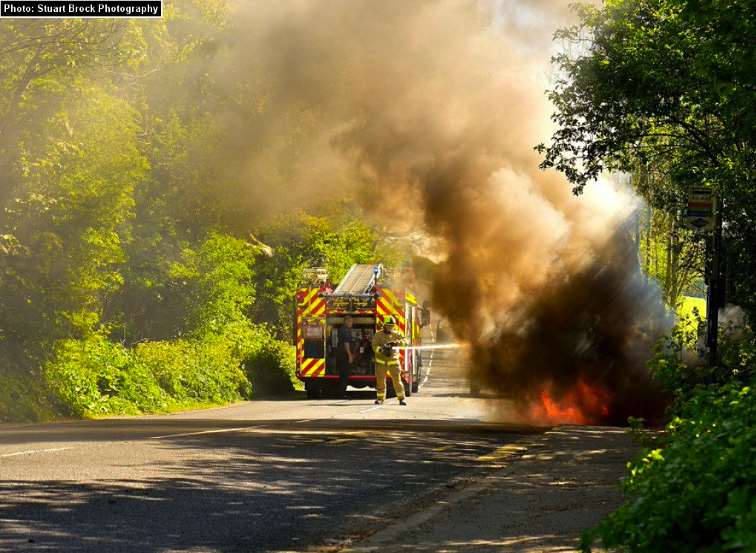 Firefighters put out car fire