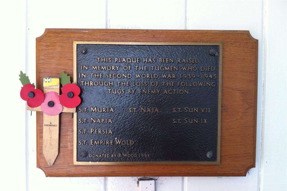 A plaque commemorates the tugmen of the River Thames