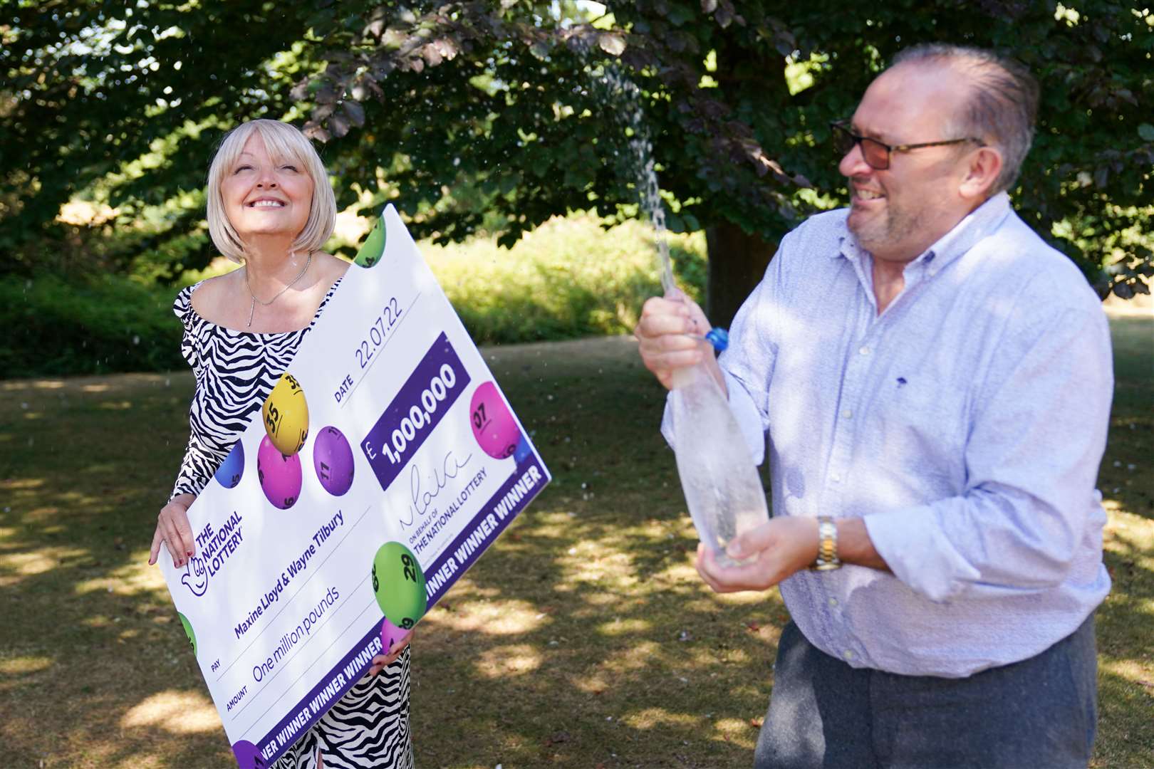 Maxine Lloyd and her fiance, Wayne Tilbury, celebrate her £1m lottery win at Barton Hall Hotel in Kettering (Jacob King/PA)