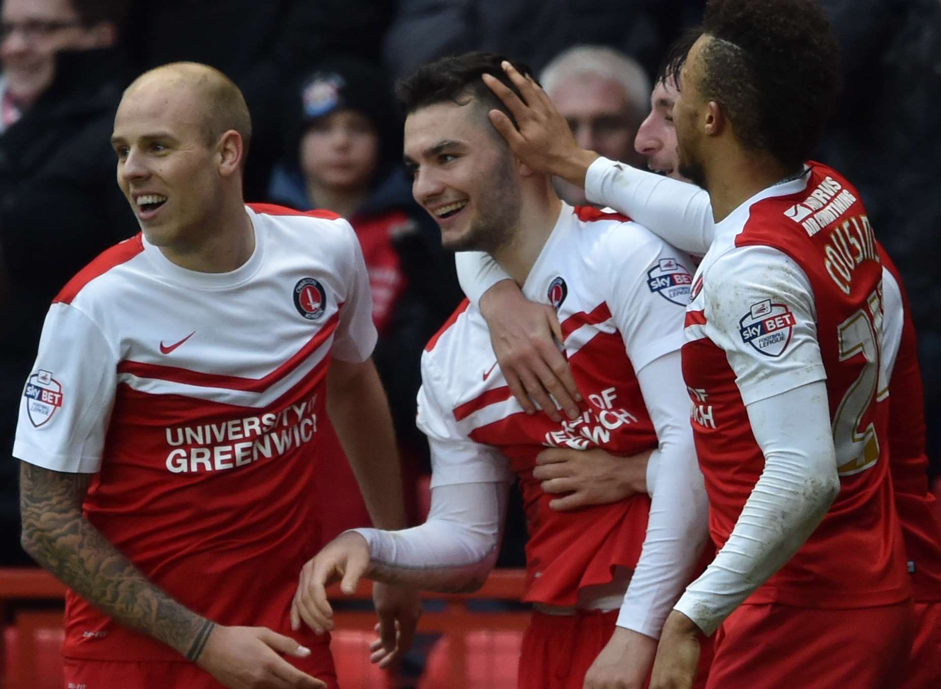 Tony Watt celebrates with team-mates after making it 3-0. Picture: Keith Gillard