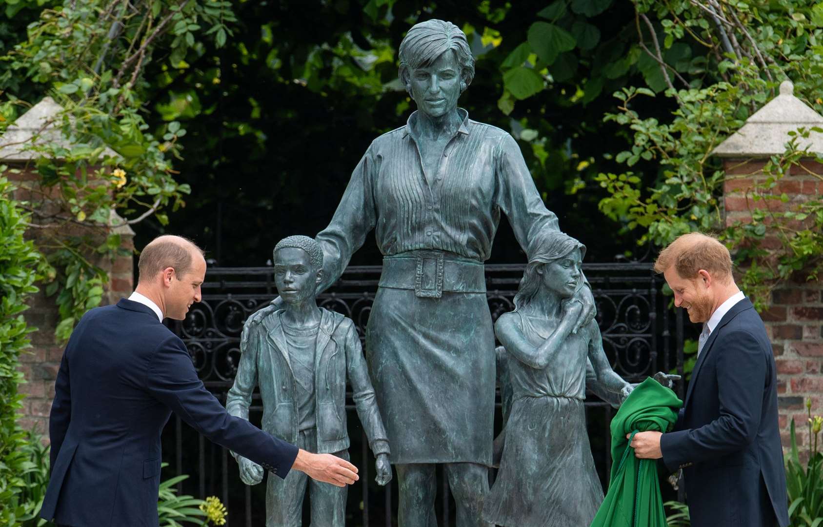 William and Harry with a statue of their mother (Dominic Lipinski/PA)