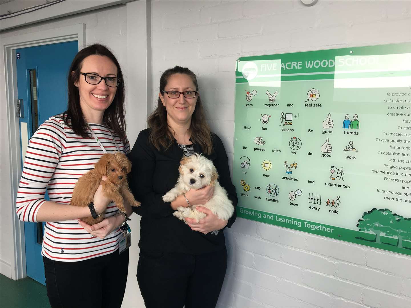 Sarah Costain and Emma Athwal with the two new dogs (7690774)