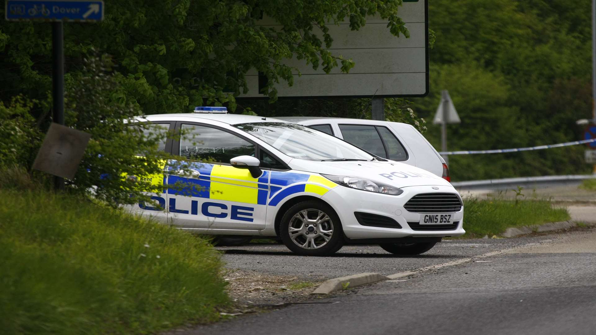 Officers at the scene after Mrs Cudworth's body was found