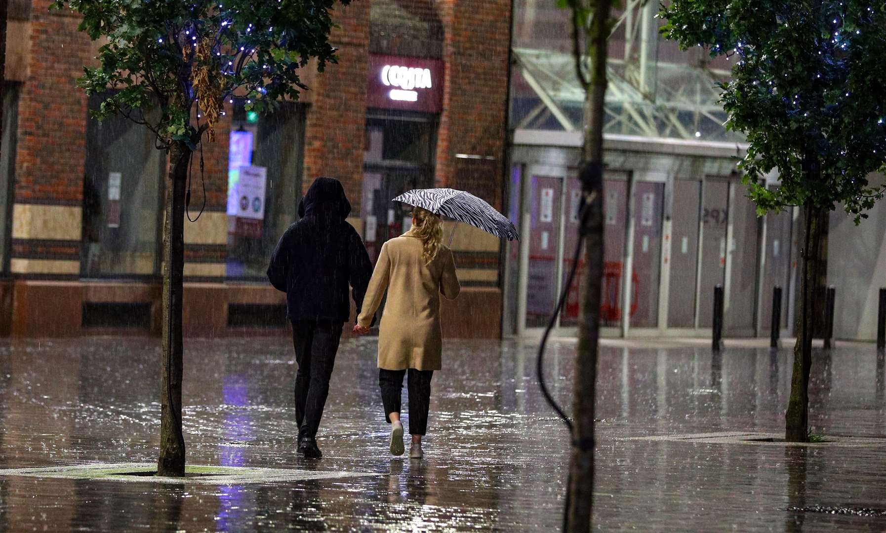 People out in Liverpool ahead of a new three-tiered system of coronavirus restrictions being introduced (Peter Byrne/PA)