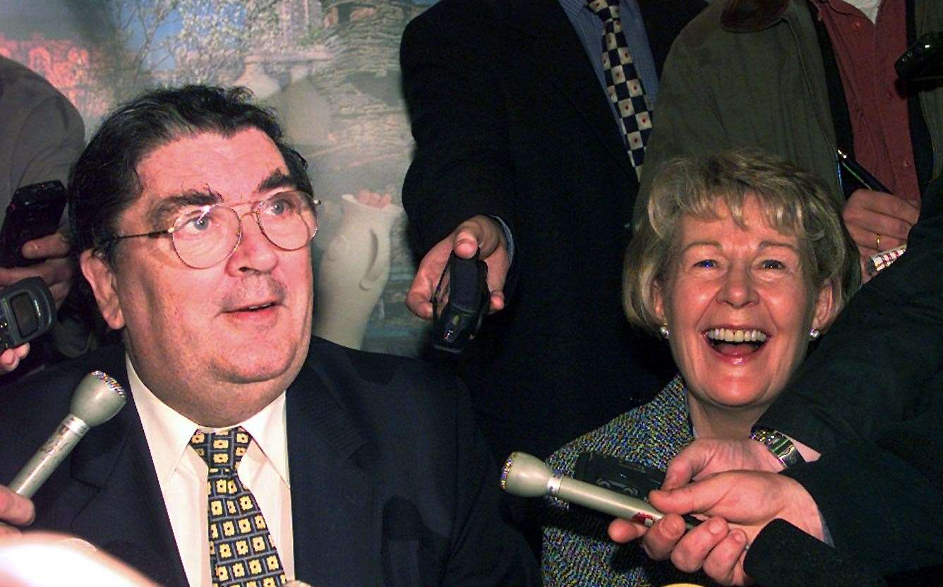 SDLP leader John Hume with his wife Pat speak to the media after he and David Trimble won the Nobel Peace Prize (PA)