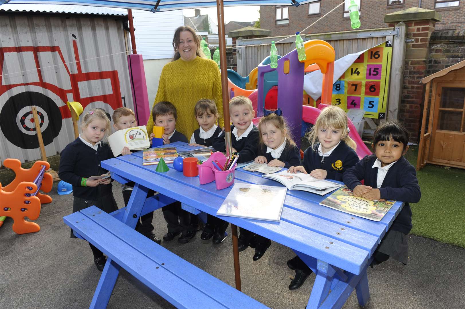 Children with some of the newly donated play items