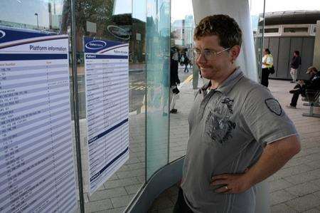 Richard Carwardine, 35, from Chatham, looks puzzled at the instructions showing where to catch his bus.