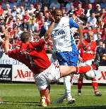 NO WAY THROUGH: Luke Young blocks a shot by Fitz Hall. Picture: BARRY GOODWIN