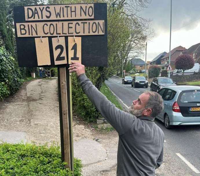 Sittingbourne's Andy Duffus put a sign outside his home to show how long he'd had to wait for collections. Picture: Becci Duffus