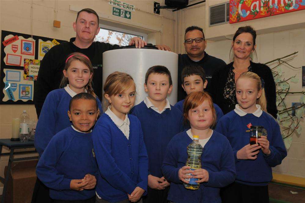 Pupils with the Oil Works container at Eastchurch Primary School