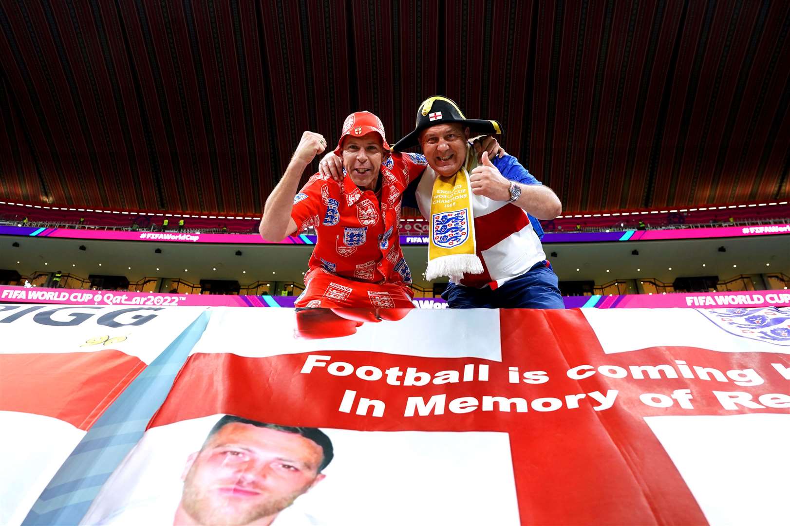 Mark Trigg (left) and Garford Beck in the stands ahead of the round of sixteen match between England and Senegal (Martin Rickett/PA)