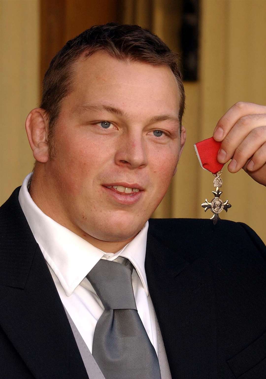 Steve Thompson, a member of England’s World Cup-winning rugby union side with his MBE after it was presented to him by the Queen at Buckingham Palace (John Stillwell/PA)