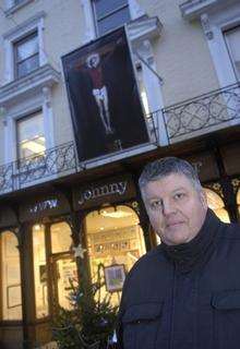 John Cotter outside his gallery with the Beckam painting